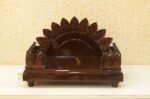 Dark brown glossy Teak Wood Devpaat with a sunburst petal backrest for placing Hindu deities, manufactured by Creata Poojaghar.