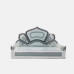 Contemporary clear glass Devpaat with a stylized lotus backrest and mirror accents, reflecting a minimalist and modern spiritual aesthetic by Creata Poojaghar.