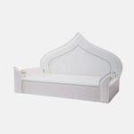 Elegant all-white glass devpaat with a dome-shaped backrest and subtle mirror trim, designed for a modern home temple by Creata Poojaghar.