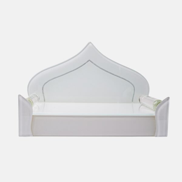 Elegant all-white glass devpaat with a dome-shaped backrest and subtle mirror trim, designed for a modern home temple by Creata Poojaghar.