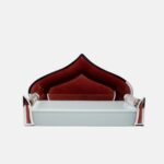 Modern glass devpaat featuring a deep maroon temple-dome shaped backrest with silver mirror borders and a frosted glass base, handcrafted by Creata Poojaghar.